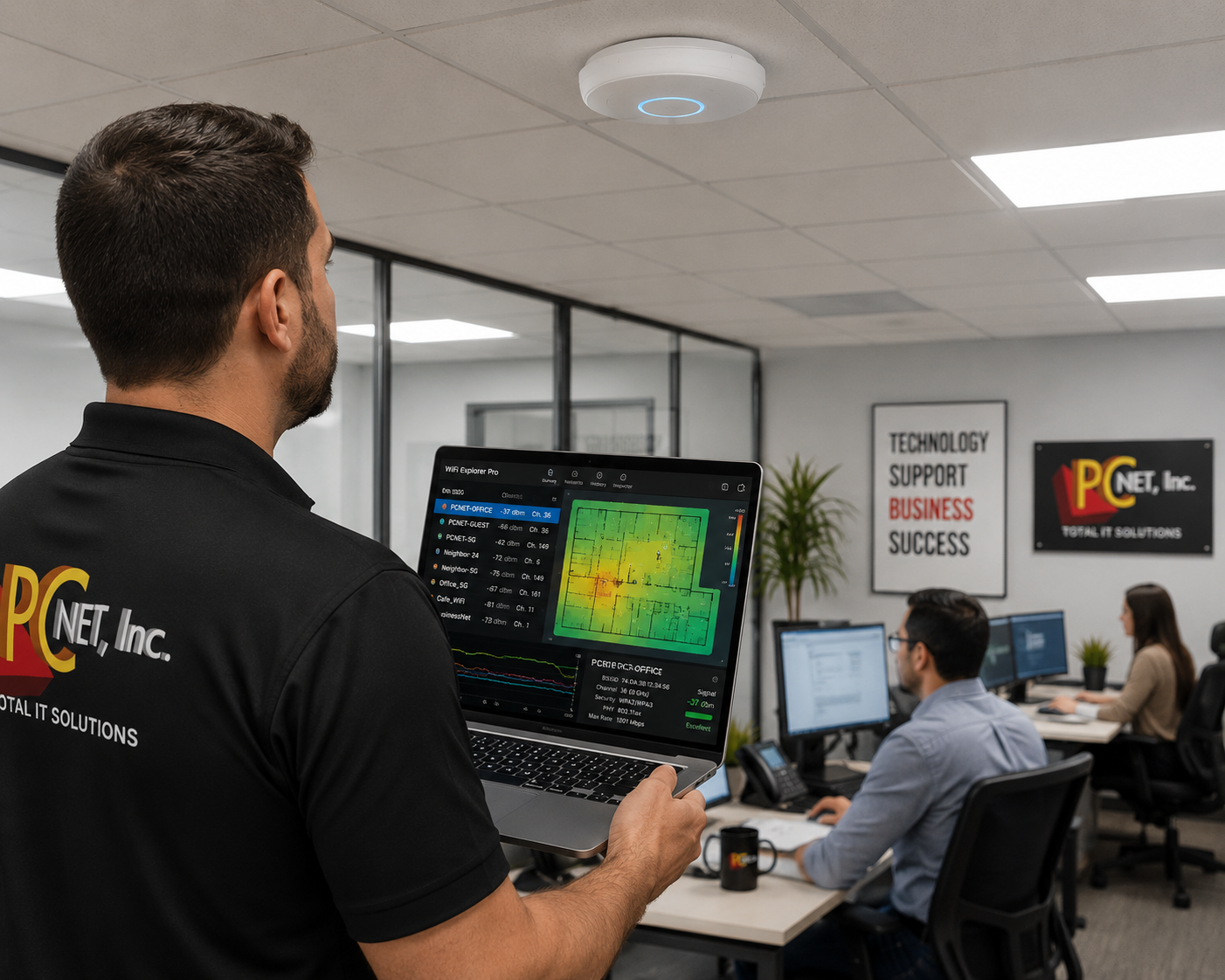 PC Net technician diagnosing Wi-Fi signal strength and network coverage in a Miami office